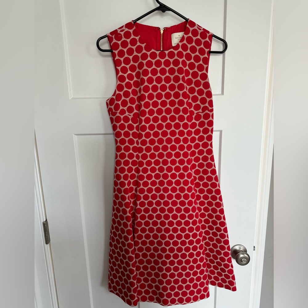 Flattering retro silhouette with polka dot pattern.